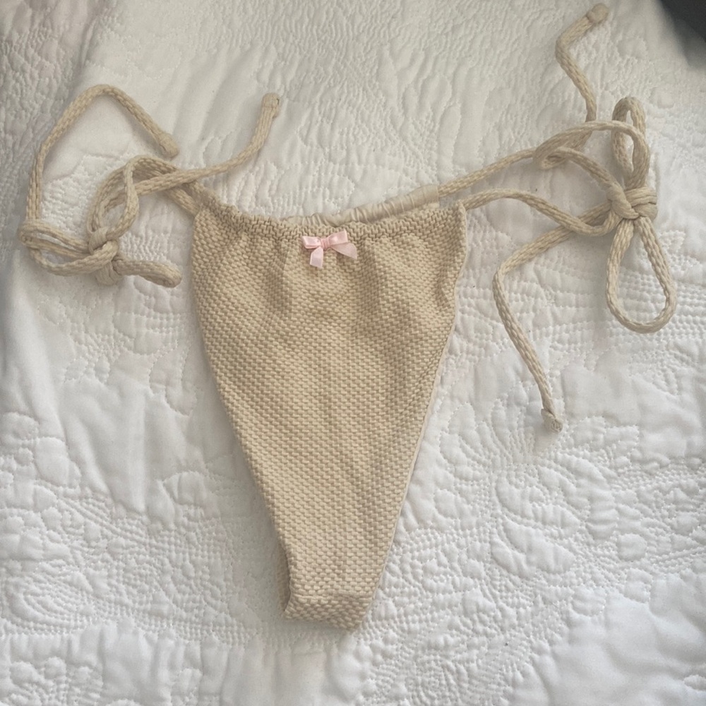 Beautiful waffle, cream color, Frankie’s bikini bottom with a pink bow worn once